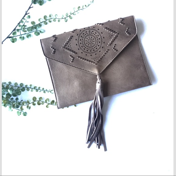 Anthropologie Handbags - Anthropologie tassel clutch purse brown laser cut